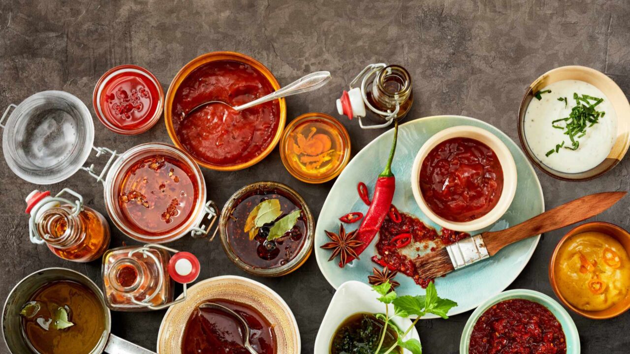 Bowls of sauces partially covering background