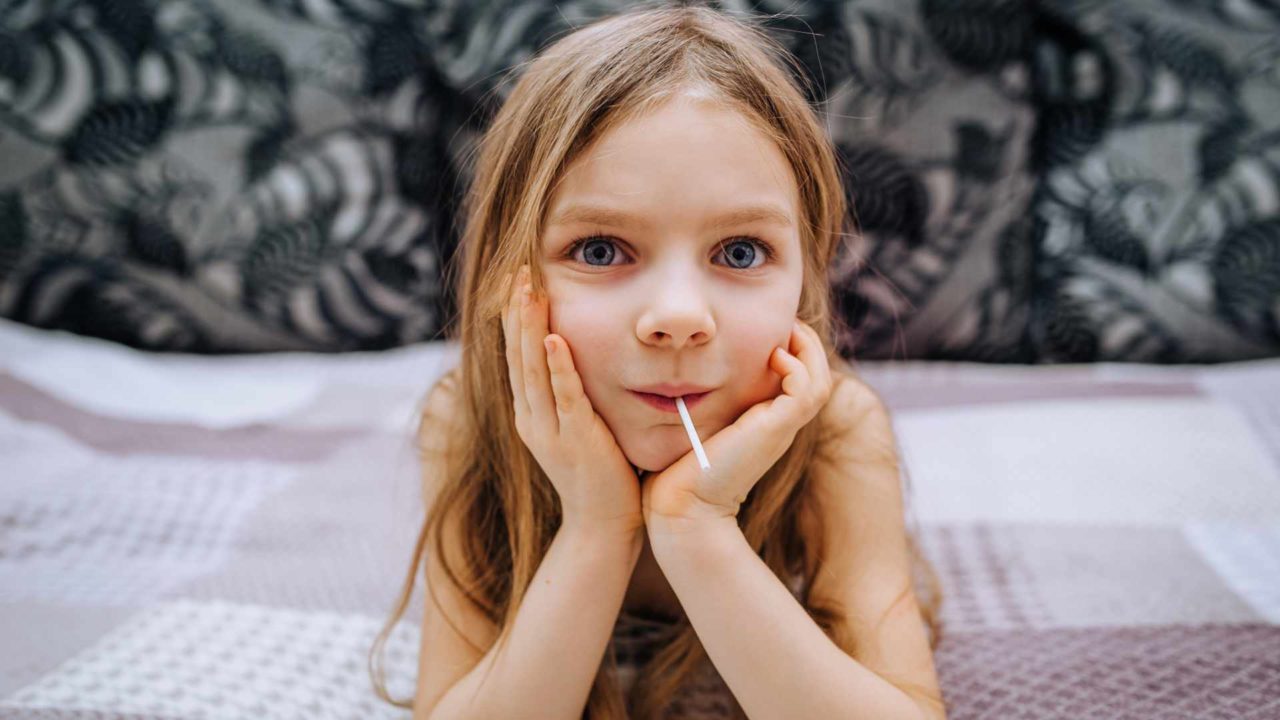 United against COVID-19: Novid20 and Retarus A,Cheerful,,Funny,Girl,,A,Red-haired,Child,Lies,On,A